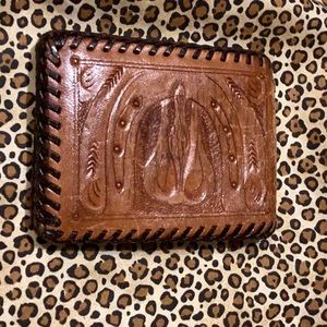 Beautiful soft leather wallet with intricate handmade art detailed throughout.